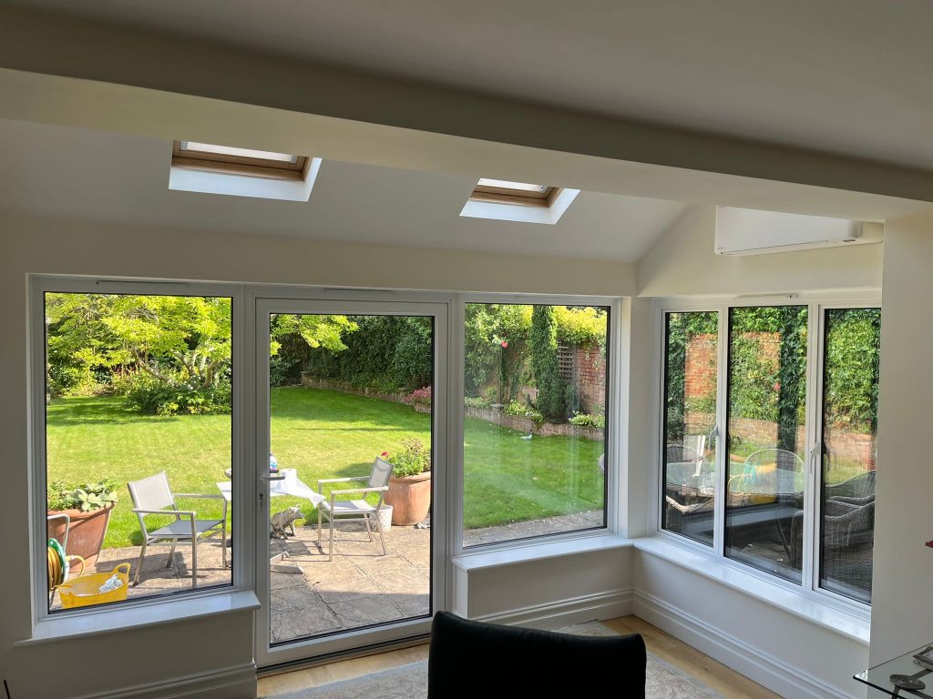 Internal view of home extension with aluminium windows and a large door