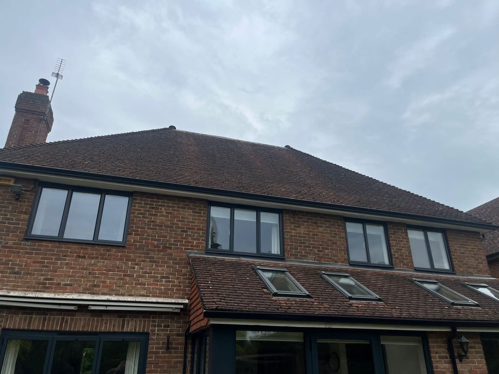 Four ALUK windows fitted in on the upper floor of a brick home