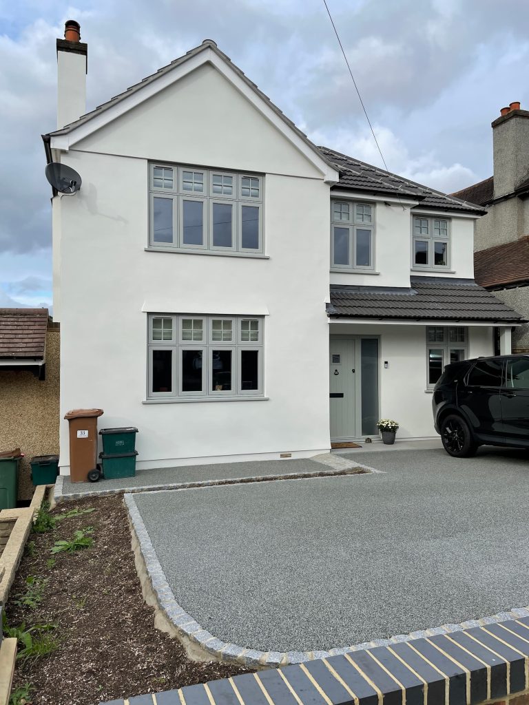 A grey house with flush sash windows.